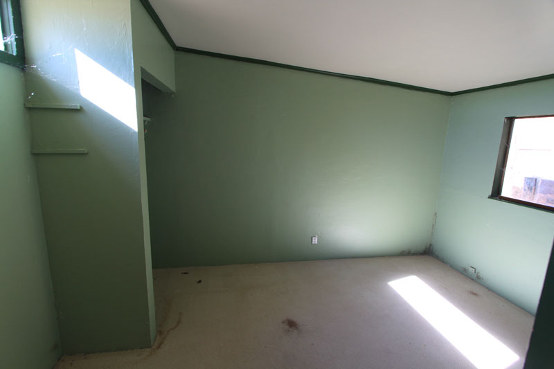 This is 2nd bedroom at the back of the house.  It shares the Master Bathroom.  It will need some serous cleaning.