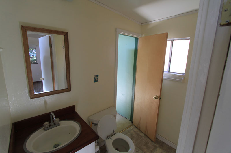 This is the master bath.  It is pretty rough.  It includes a large shower.