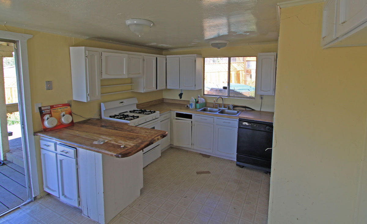 The kitchen is nice sized but but is a little rough.  Stove and dishwasher are in good shape but cabinets need a little repair.  Refrigerator is not shown here but is included.