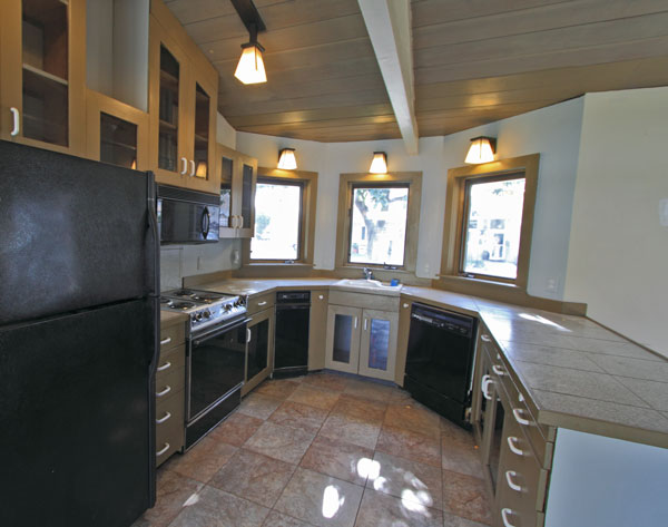 The kitchen is a dream to work in.  Loads of cabinet space and lots of drawers provide amazing amounts of storage space.  Includes dishwasher and trash-compactor, and the microwave over the stove leaves the counter-space clear.  The bay windows provide light and a view.  Rather than marble, the kitchen floor is tile for better durability and slip resistance.