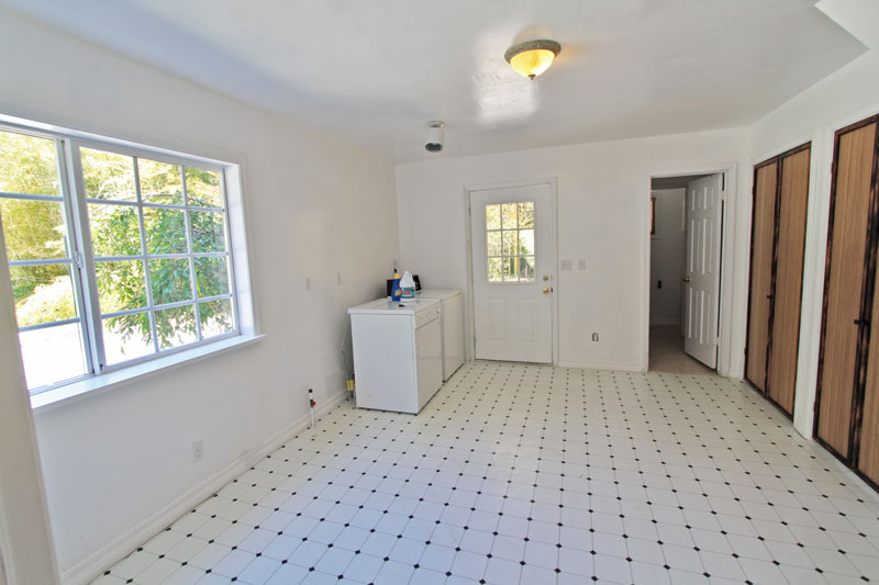 Living room downstairs has lots of closets for storage, and a washer and dryer.