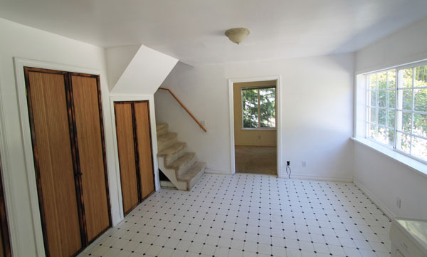 Living room with bedroom beyond.