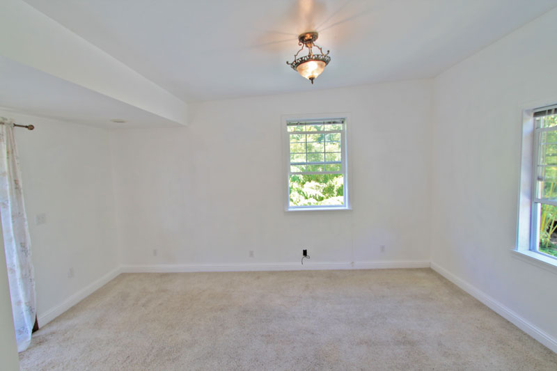 Large bedroom/living room with lots of light and space.