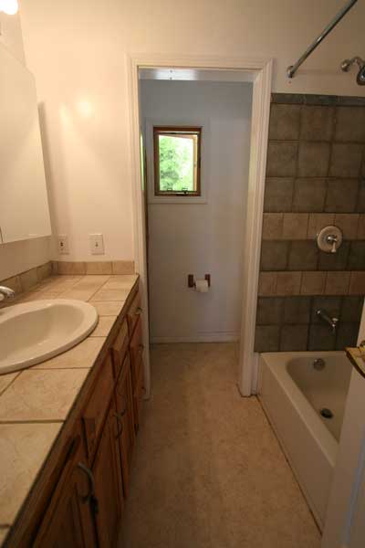 Full bath downstairs with tub and shower.