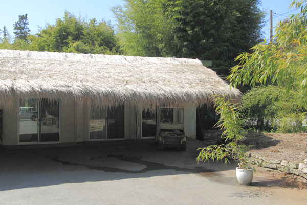 Here is the front of the building with the covered parking in front.